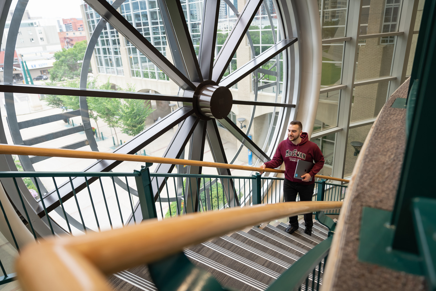 Image of MacEwan Clock from inside on the library stairs