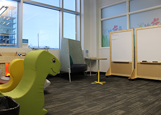 Image showing the family care area from the door showing most of the furniture and activites/toys